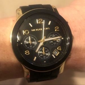Black and gold Michael Kors watch